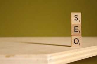 a scrabbled wooden block with the word SEO on it