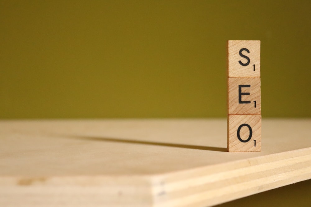 a scrabbled wooden block with the word stem on it