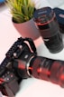 a camera and a lens on a table