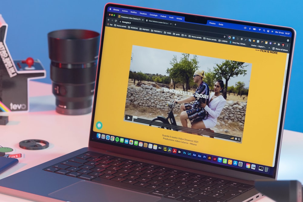 a laptop computer sitting on top of a desk