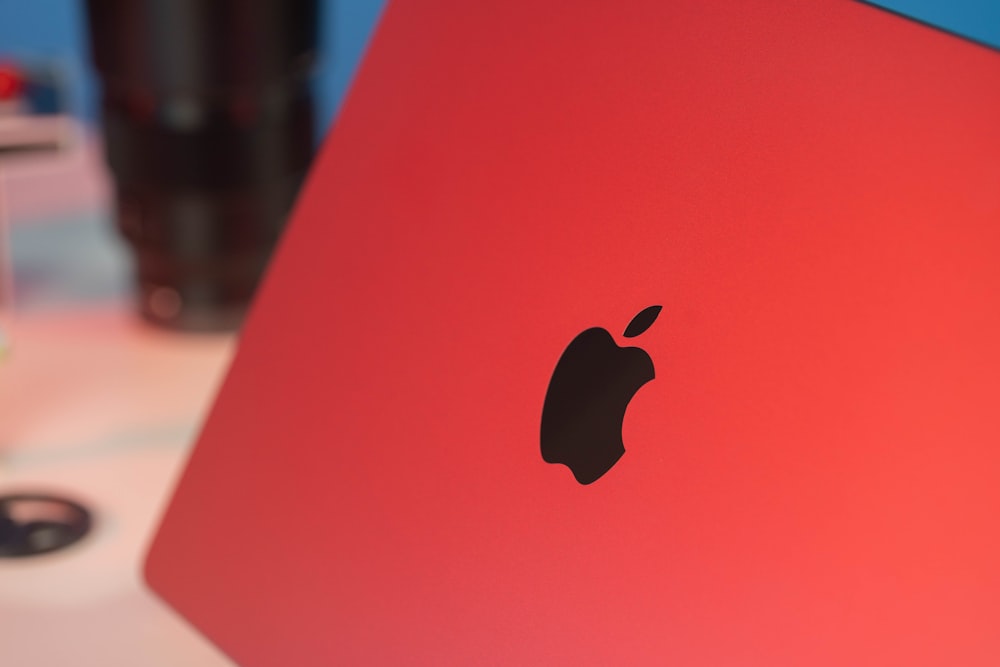 a close up of an apple laptop on a table
