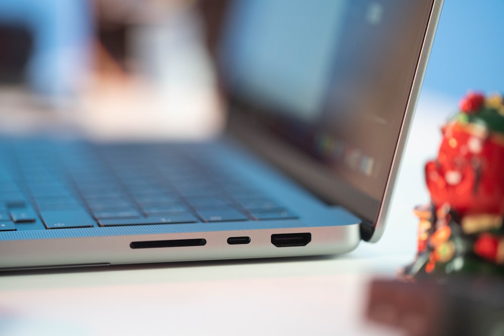 a laptop computer sitting on top of a table