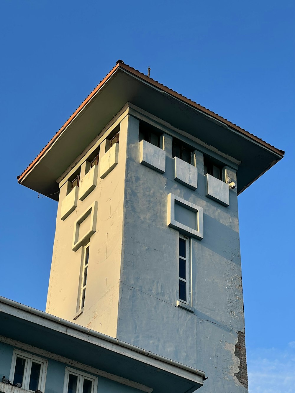 a tall building with a clock on the top of it