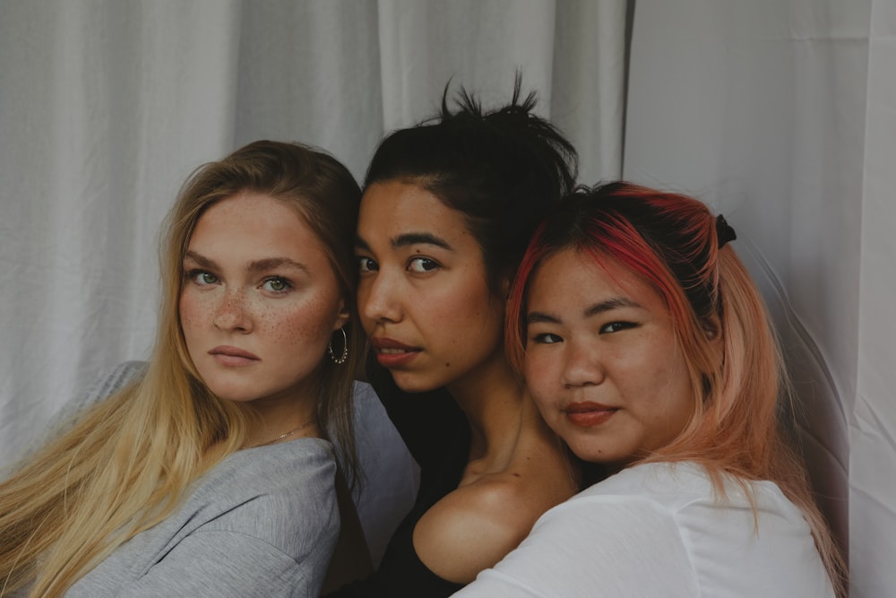 three women are posing for a picture together