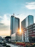 a couple of tall buildings sitting next to each other
