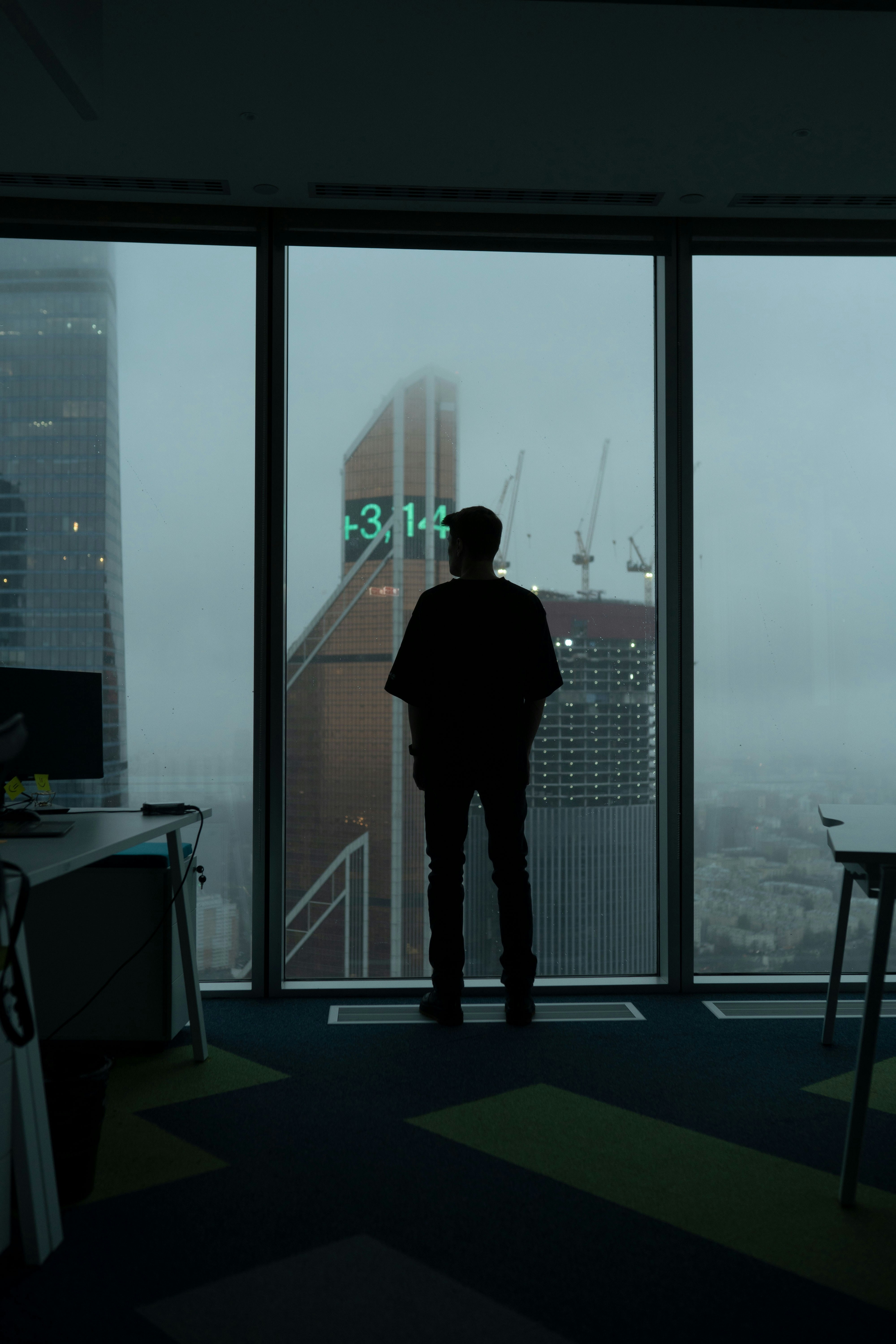 A man standing in front of a large window photo – Free Human Image on ...
