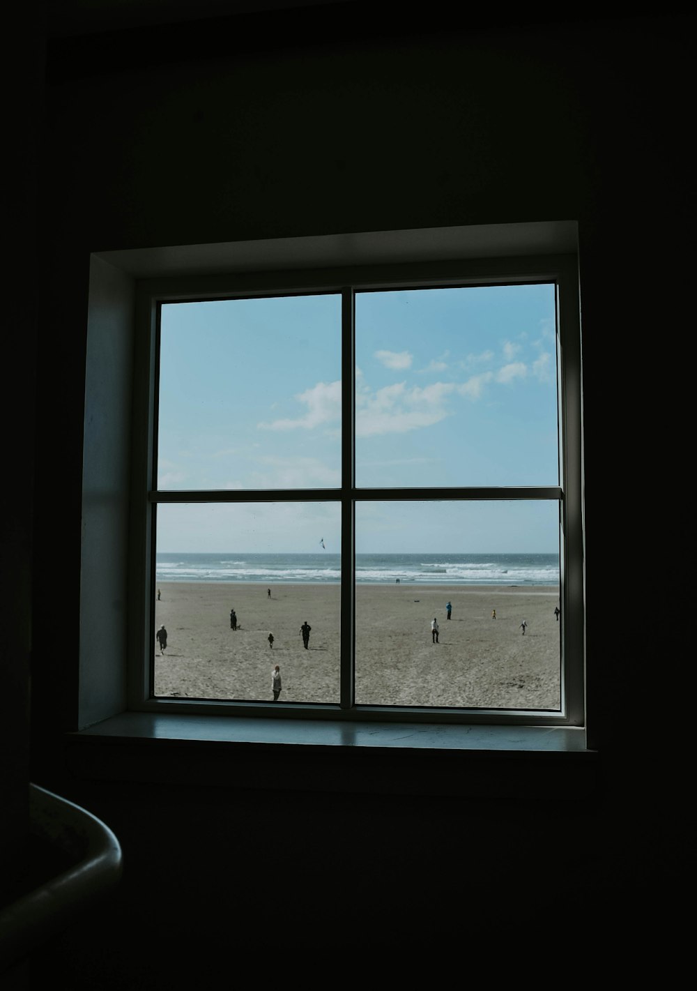 a view of a beach from a window
