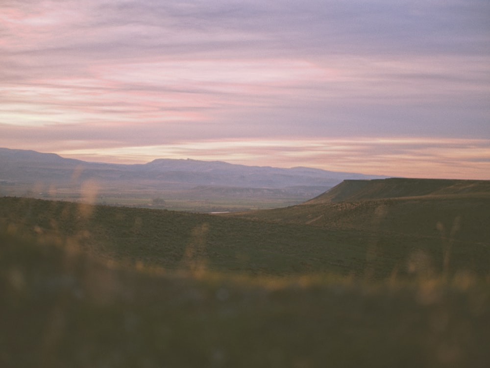 a view of a mountain range with mountains in the distance