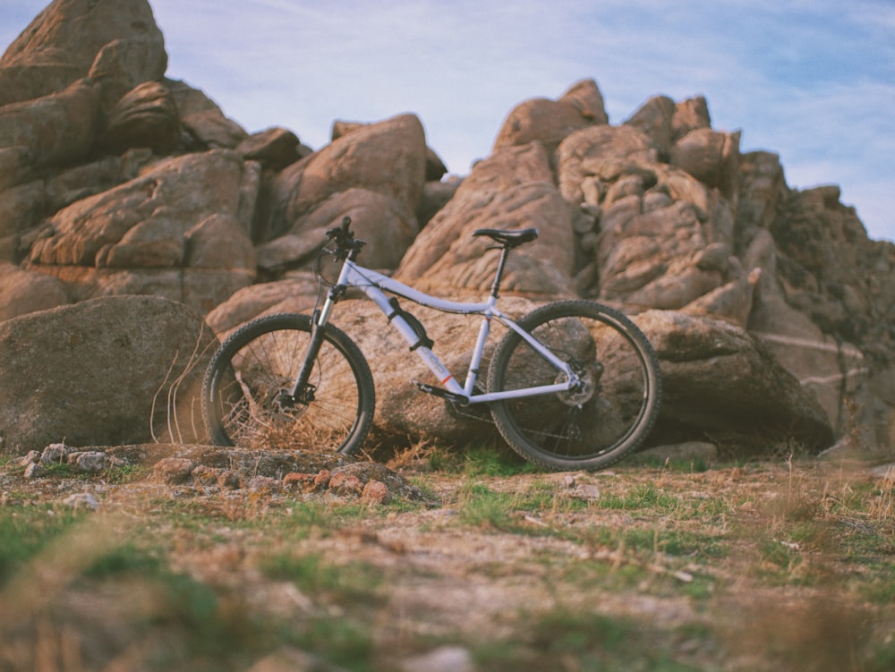 a mountain bike parked in front of some rocks