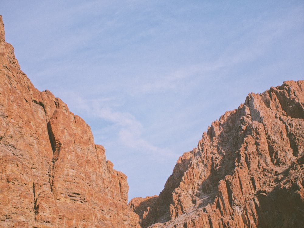 a rocky mountain with a sky background