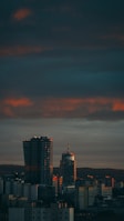 A city skyline at dusk highlighting newly developed commercial buildings.