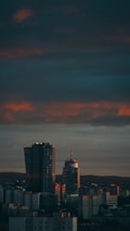 City skyline at dusk with courthouse silhouette, reflecting legal support.