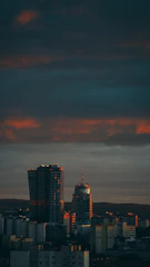 A sleek Houston skyline at dusk, highlighting modern skyscrapers under a deep emerald sky.