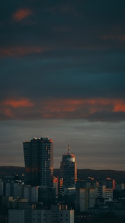 A city skyline at dusk symbolizing urban development and human capital growth.