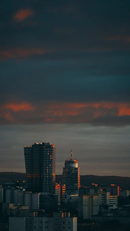 A modern city skyline at dusk representing global reach and innovation.