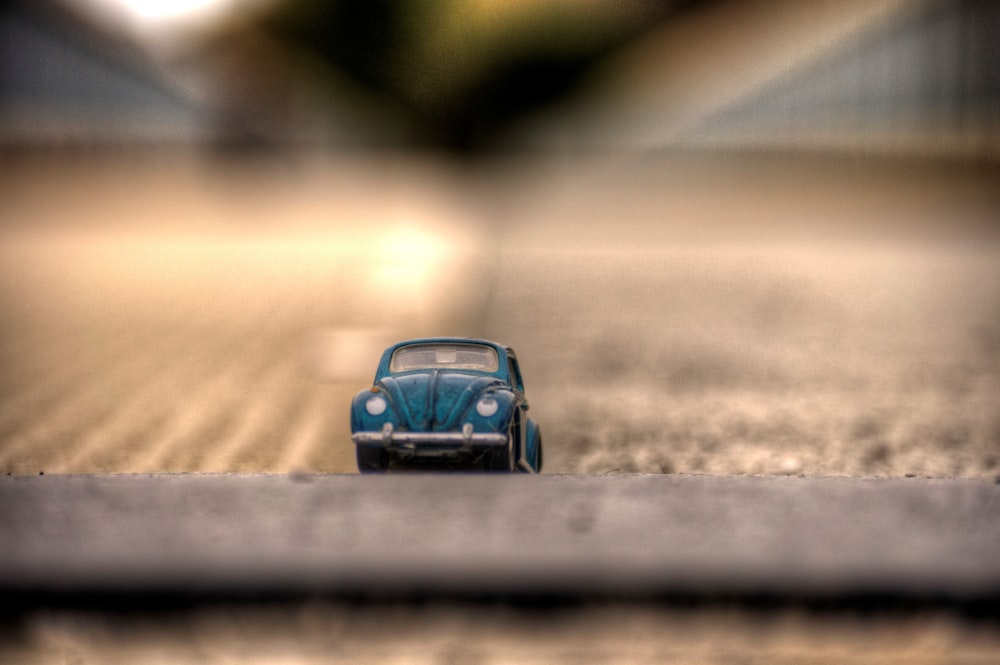 a toy car is sitting on the ground