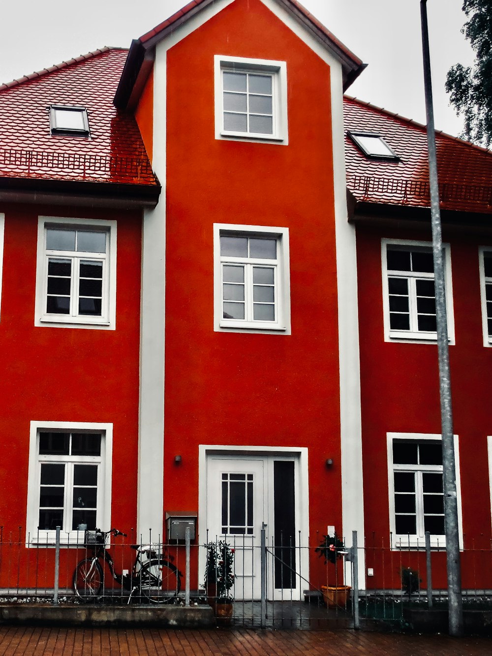 a red building with a bicycle parked in front of it