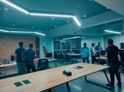 A sleek, modern office space with focused professionals collaborating in a bright, elegant environment.