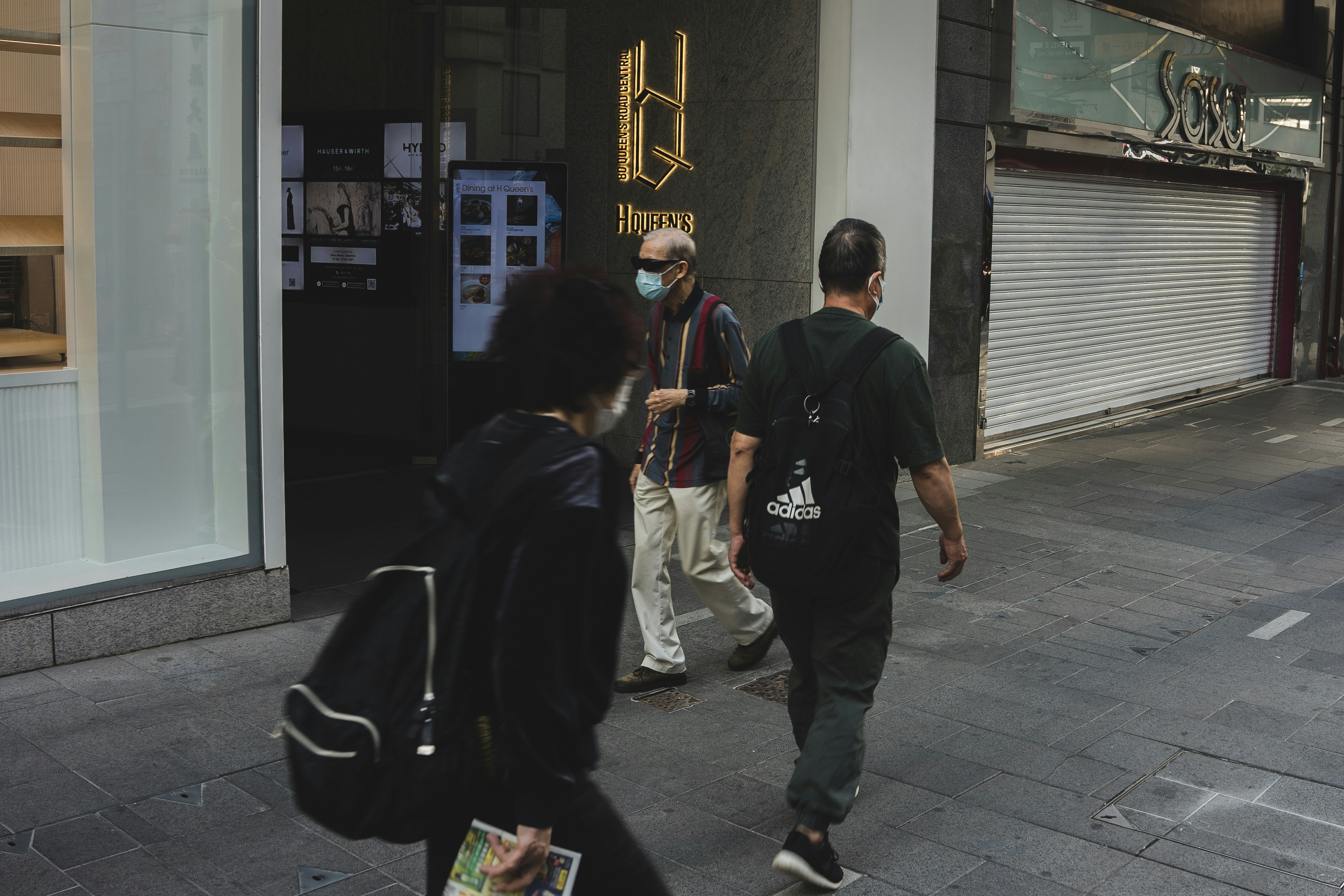 a group of people walking down a street