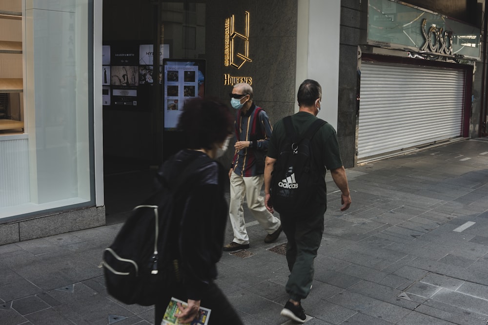 a group of people walking down a street