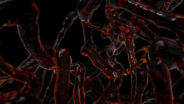 a bunch of red and black chains on a black background