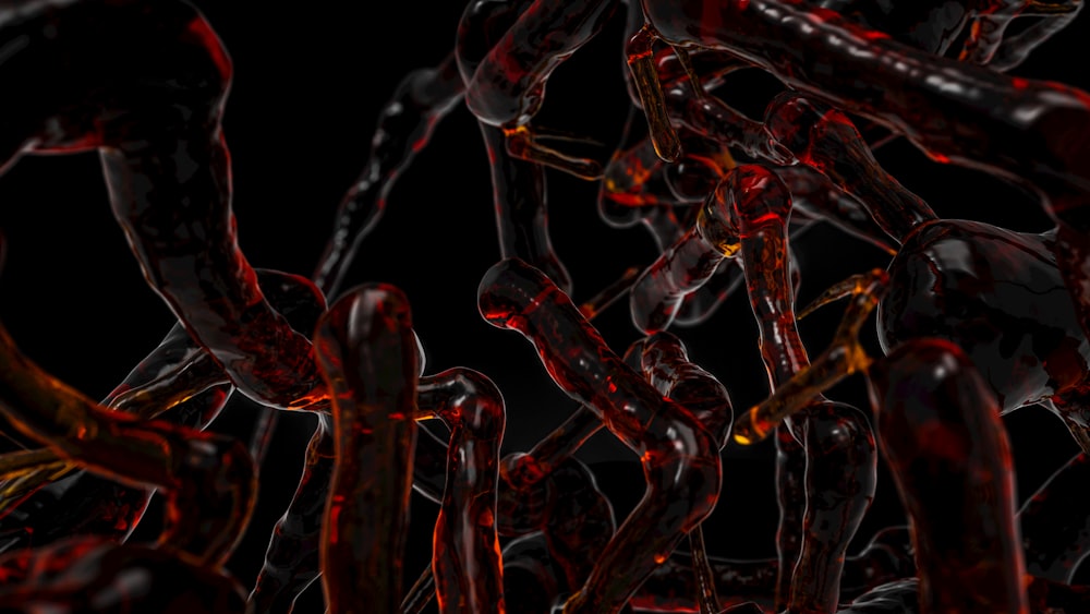 a bunch of red and black chains on a black background