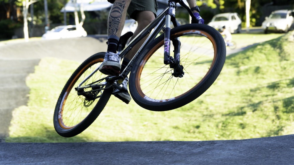 a man riding a bike up the side of a ramp