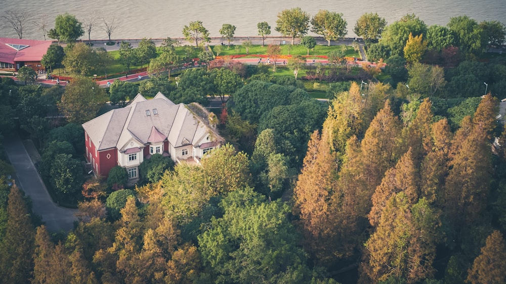 an aerial view of a house surrounded by trees