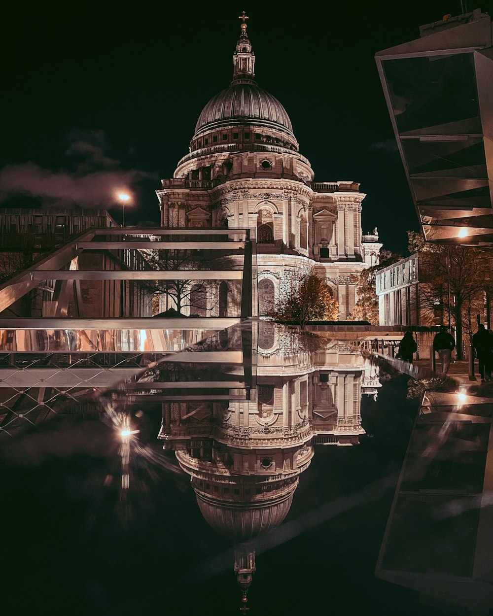 a reflection of a building in the water