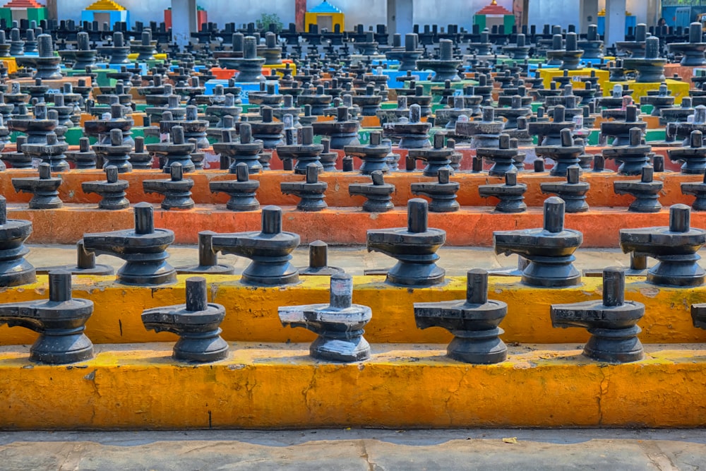 a large number of water spigots are lined up