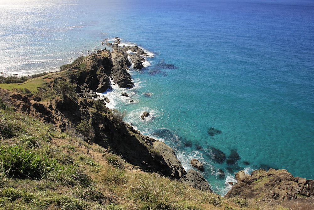 a view of the ocean from the top of a hill