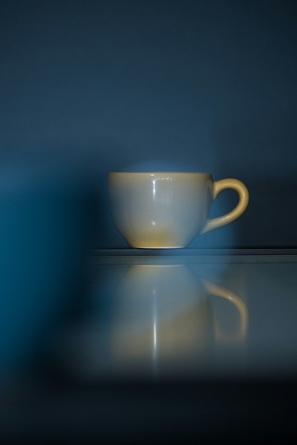 a white cup sitting on top of a table