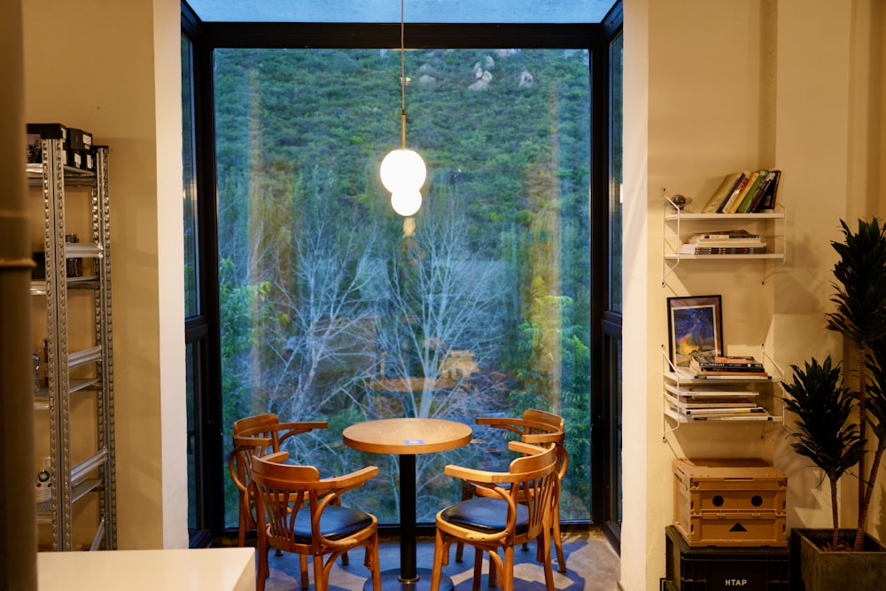 a dining room with a table and chairs