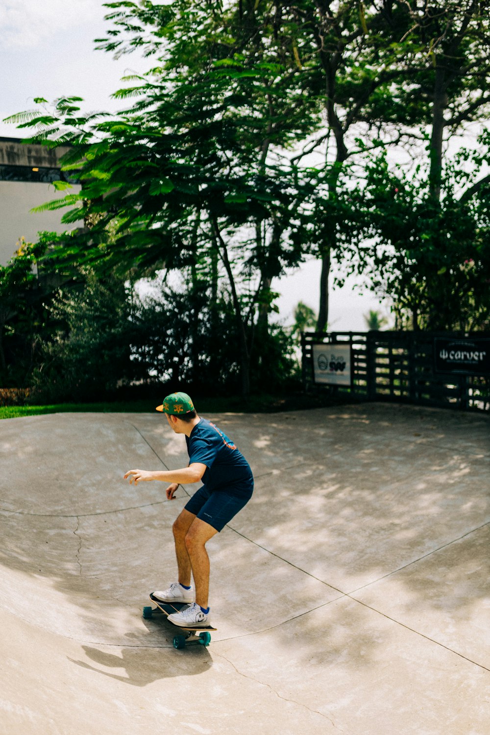 a man riding a skateboard down a cement ramp