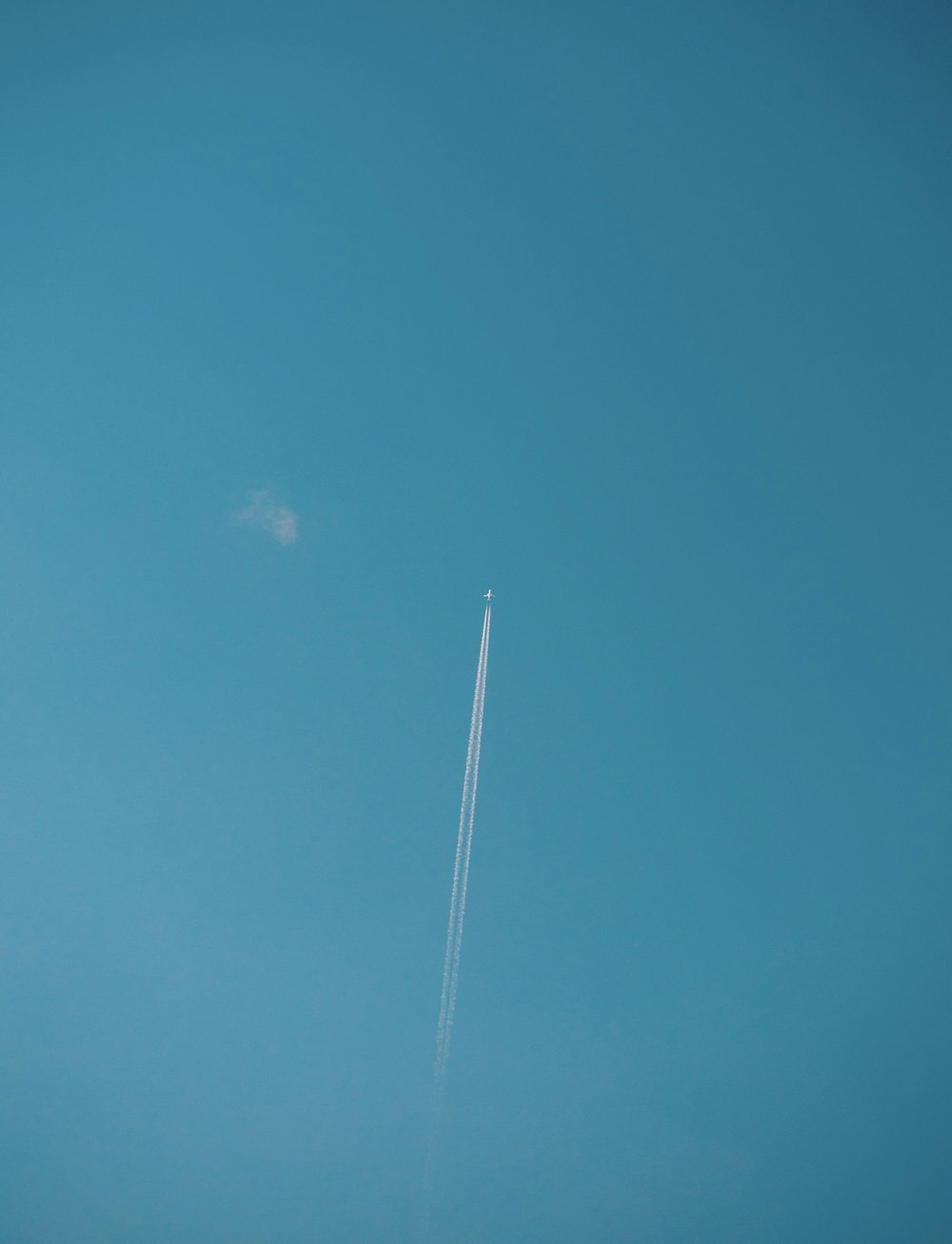 an airplane is flying high in the sky
