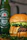 Close-up of a gourmet burger and a frothy Guinness beer on a dark wooden bar counter with warm ambient light.