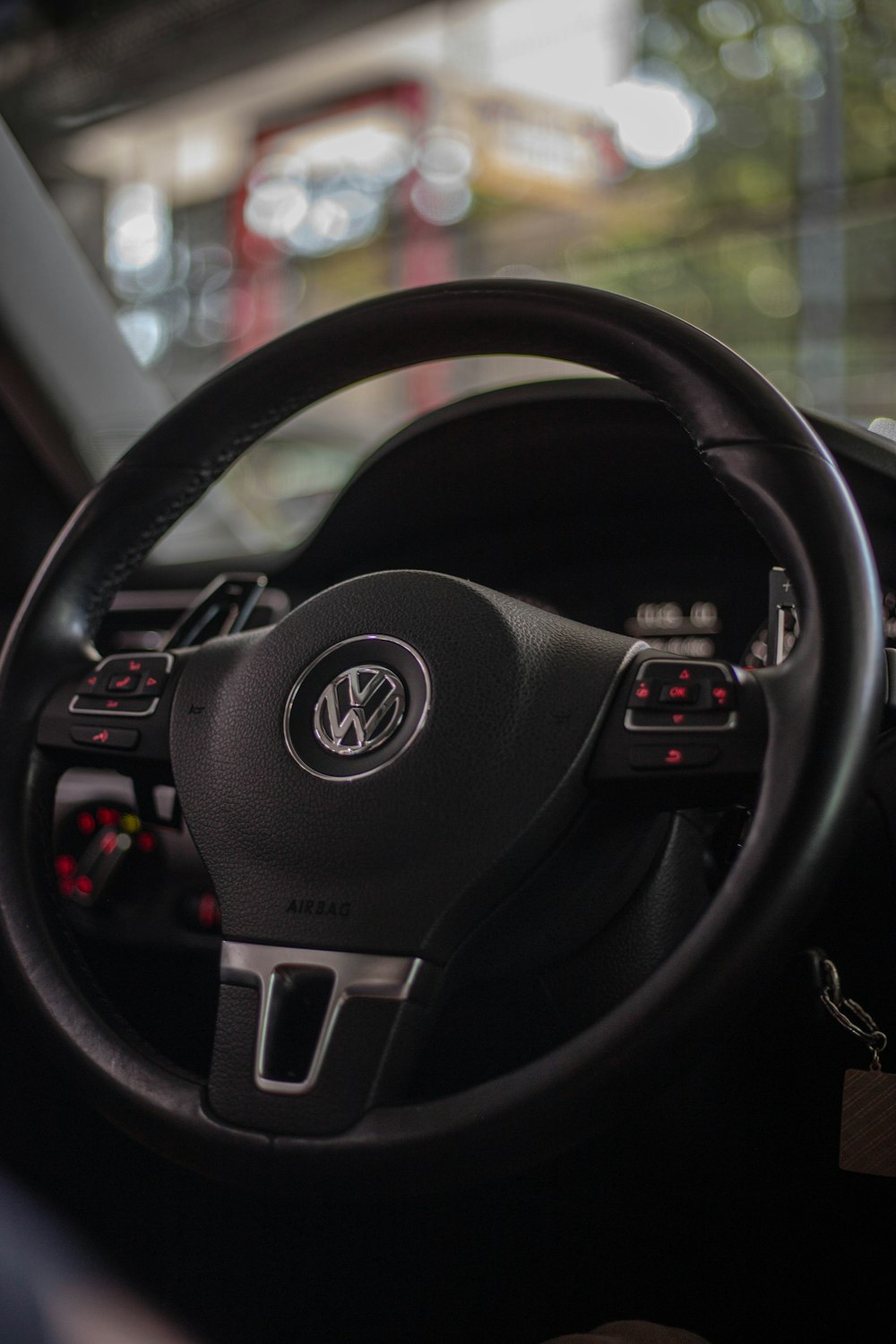 a steering wheel and dashboard of a car