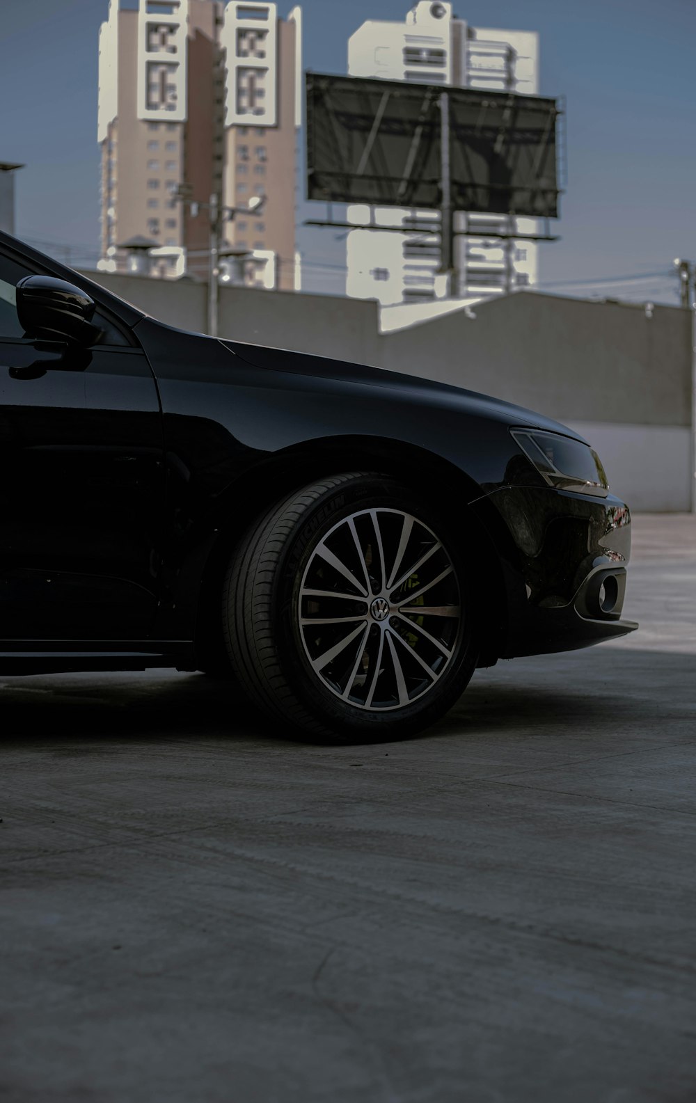 a black car parked in a parking lot