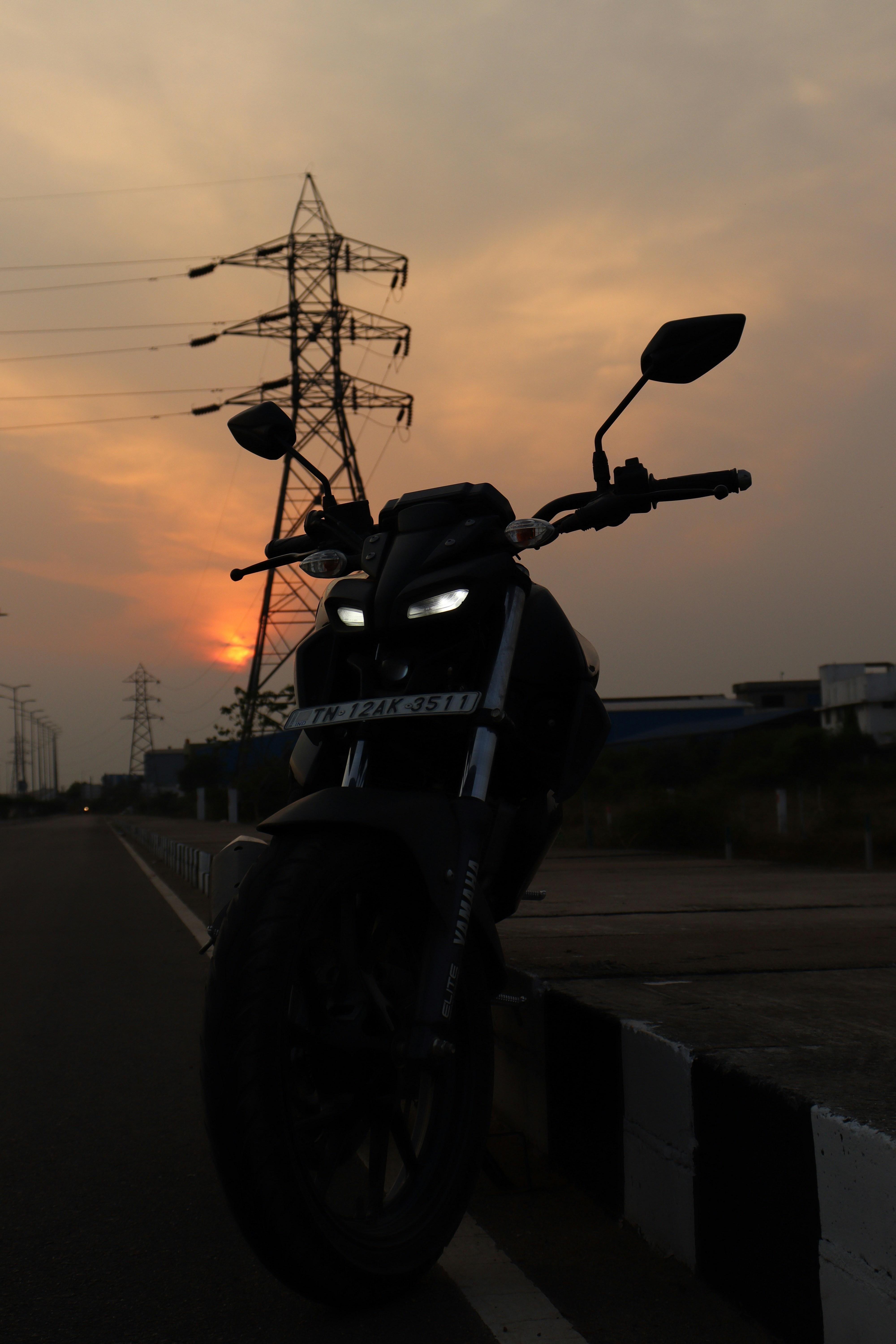 a motorcycle parked on the side of a road