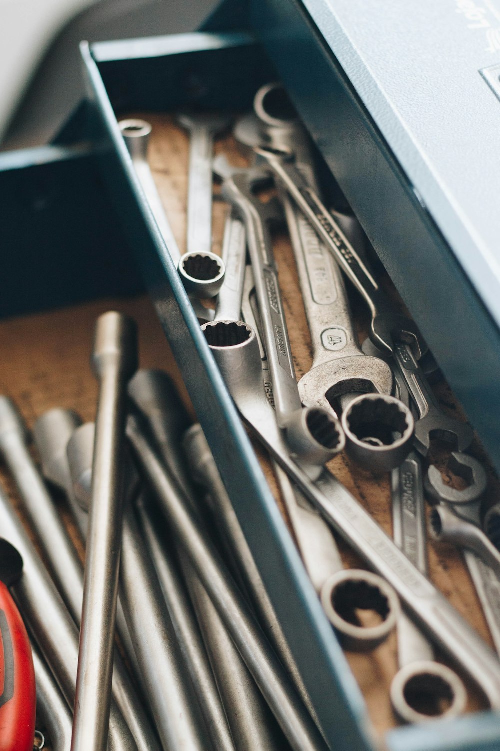 a bunch of wrenches and other tools in a box