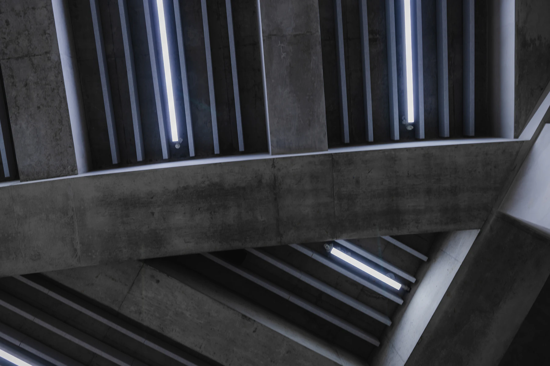 A Severe Concrete Institutional Structure Crossed By Metal Railings And Bars