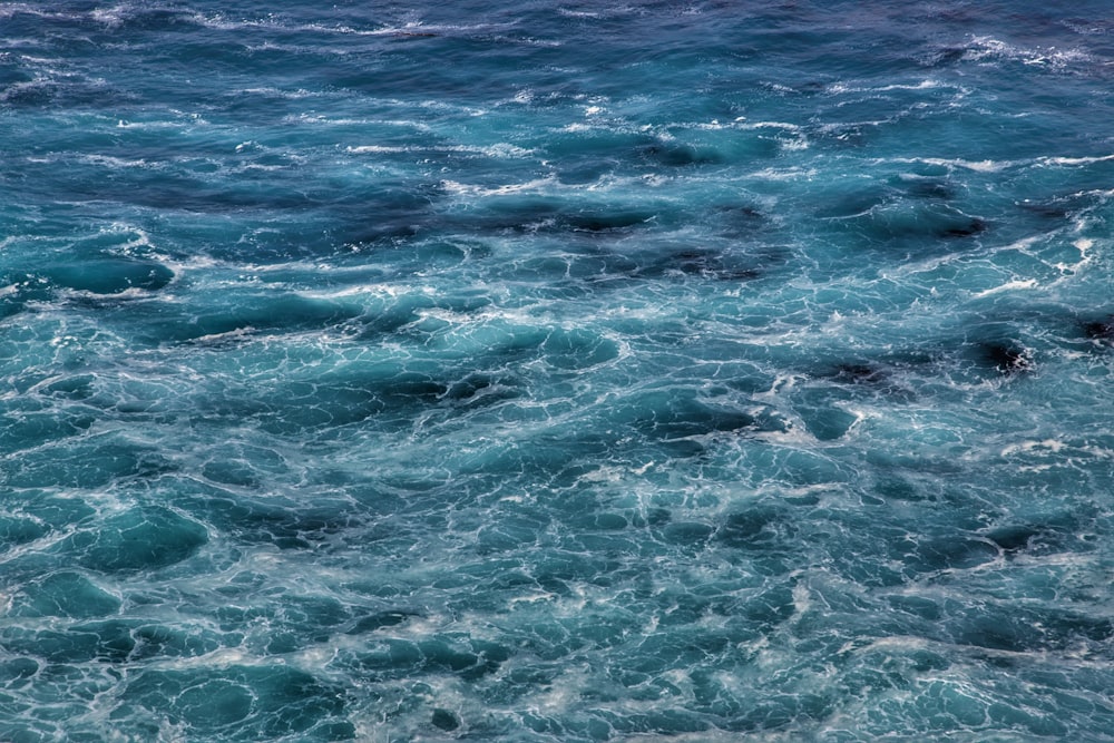 a large body of water covered in lots of blue water