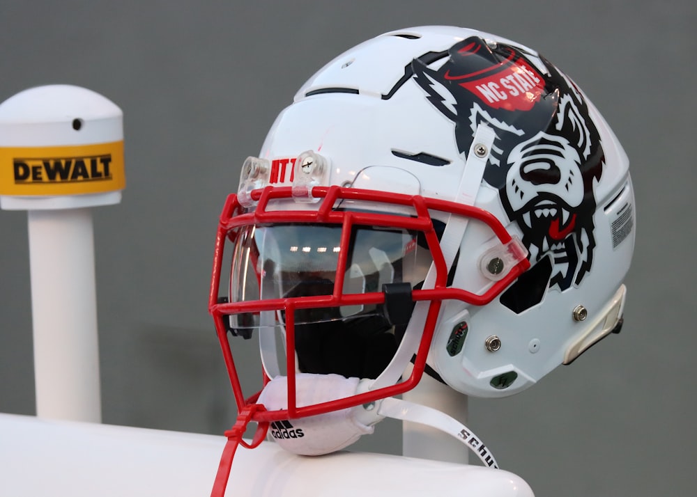 a football helmet with a visor on top of it