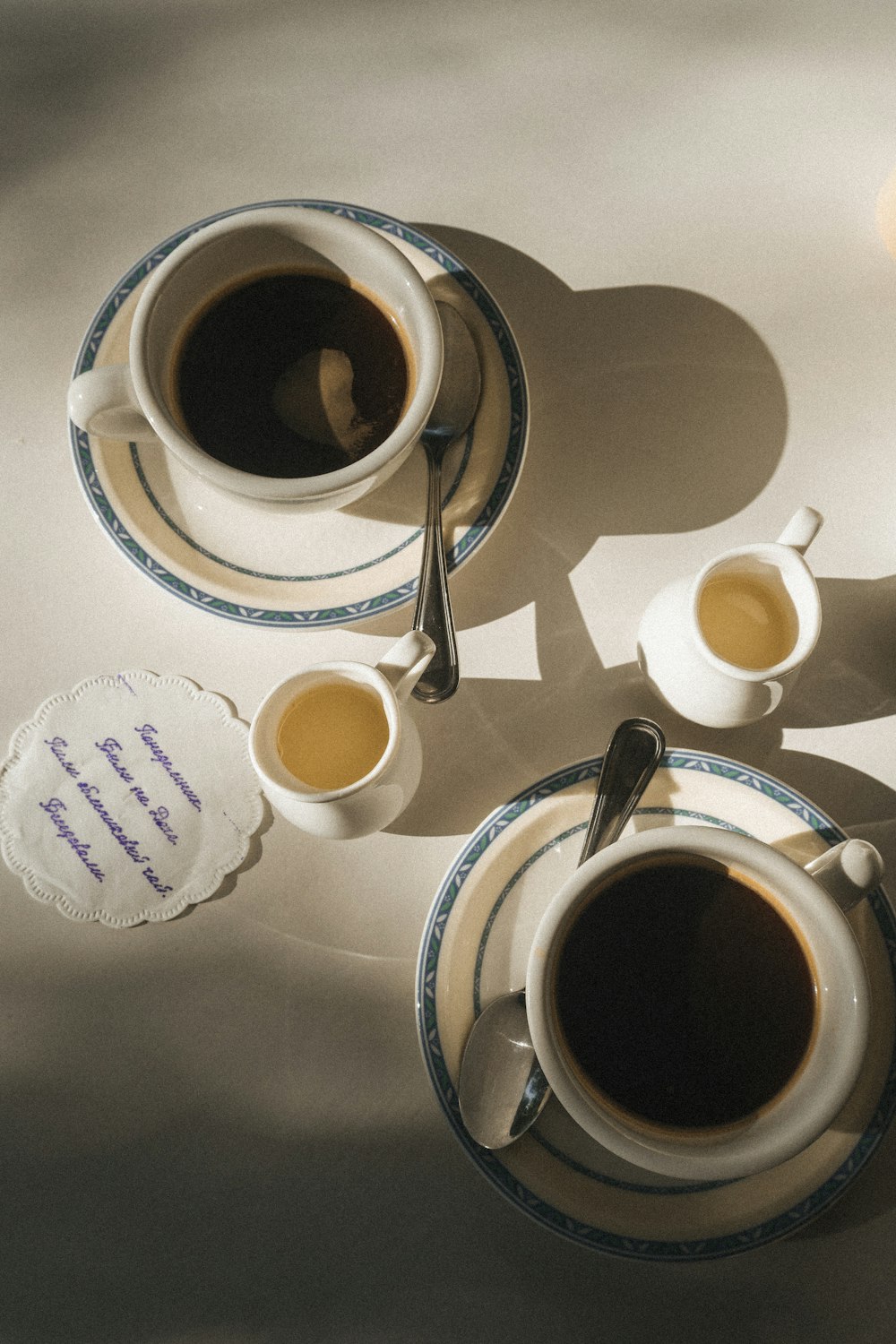 a couple of cups of coffee sitting on top of a table