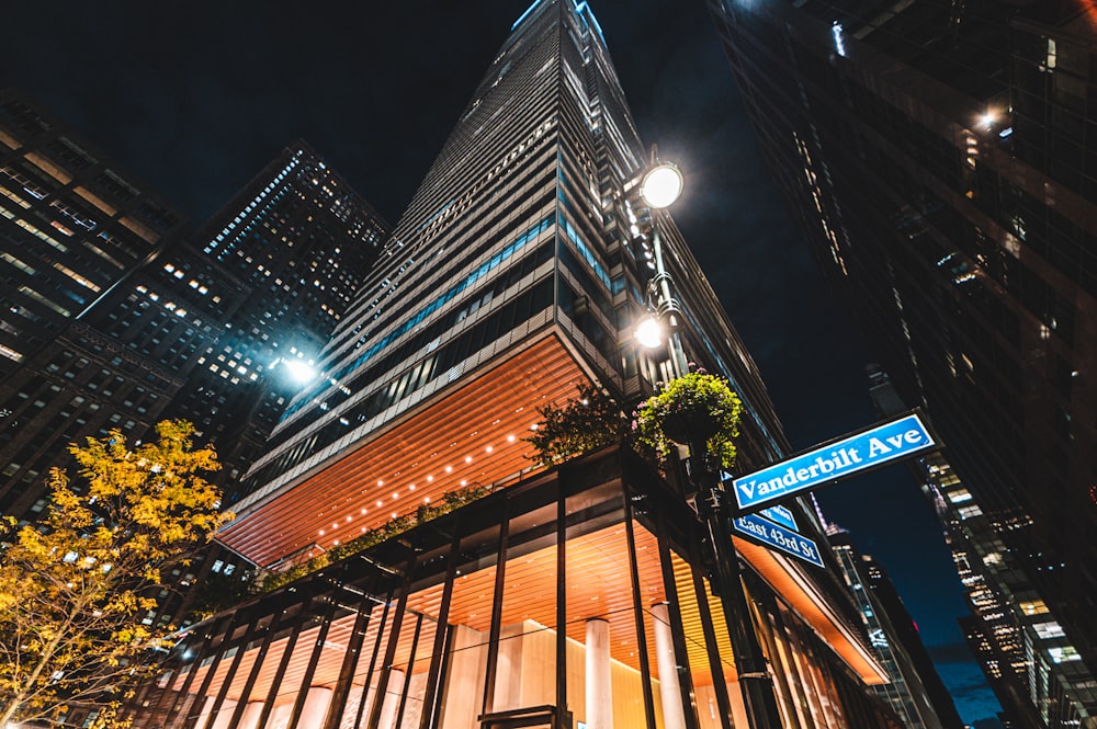 a tall building with a street sign in front of it