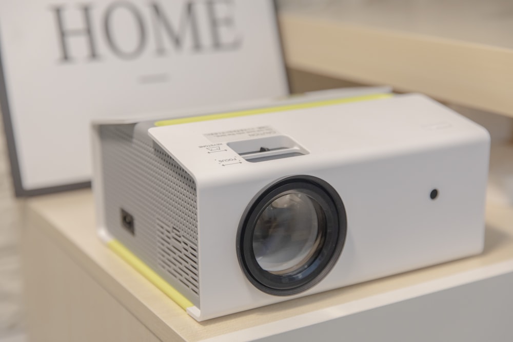 a white projector sitting on top of a table