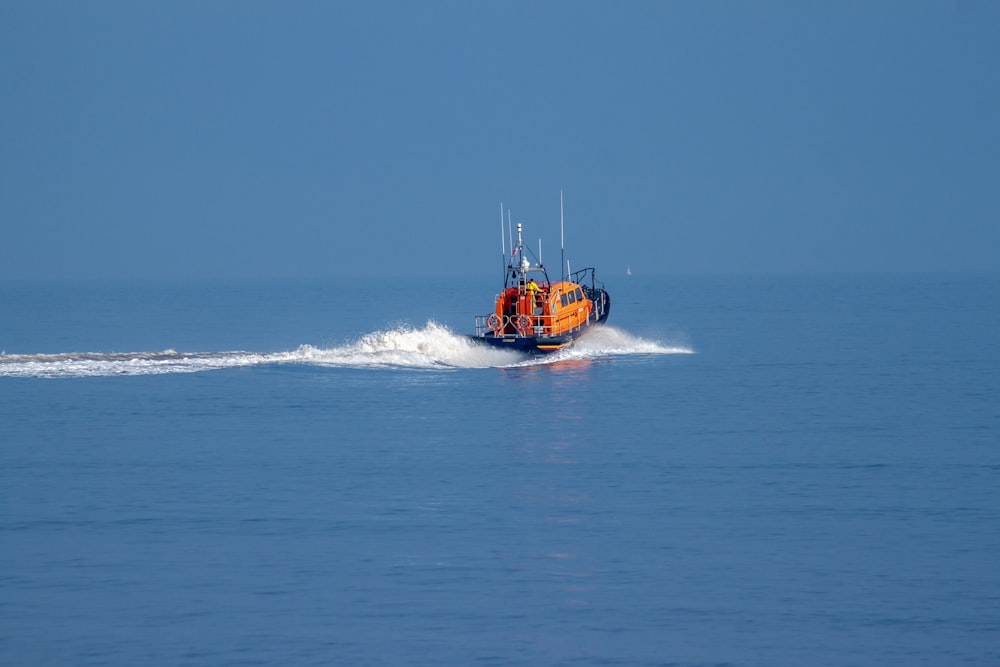 a small boat traveling across a large body of water