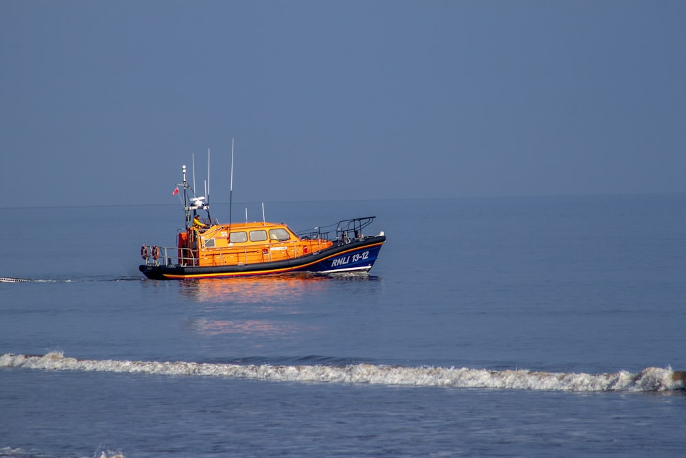 a small boat in the middle of the ocean