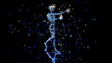 a person standing in the air with a star in their hand