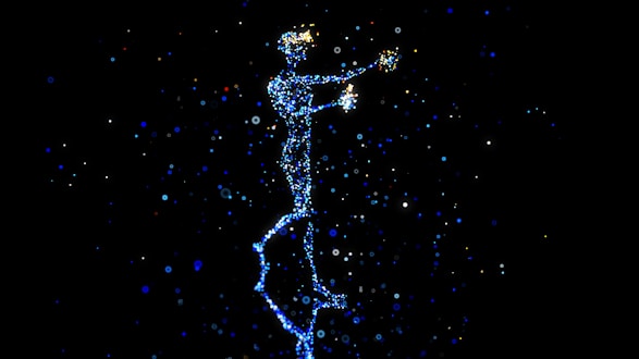 a person standing in the air with a star in their hand